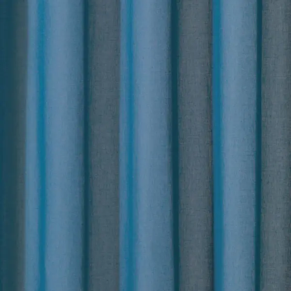 Juno inbetween transparent curtain fabric with a super soft texture, made from 100% flame-retardant polyester, shown as flowing blue-toned drapery that falls gracefully, suitable for project use and Roman blinds, OEKO-TEX certified.