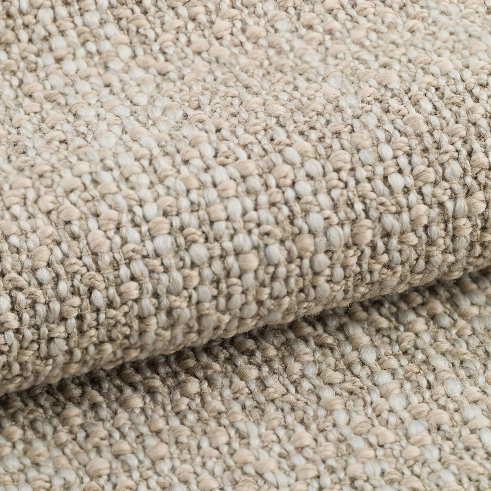 Meru upholstery fabric close-up showing a rich irregular weave with slub yarns, made from a high wool-content blend of wool, cotton, and polyamide, featuring a natural handcrafted texture, OEKOTEX certified.