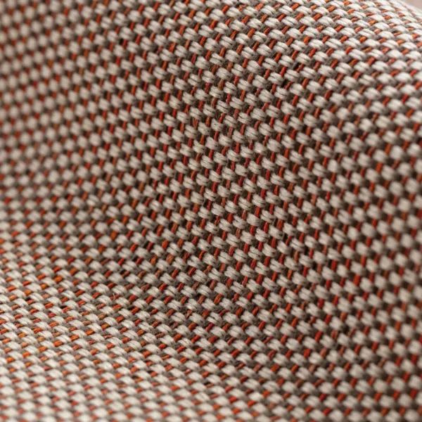 Pine upholstery fabric with a multi-colored woven texture and subtle accent yarns, made from a durable blend of polyester, cotton, acrylic, and linen, shown upholstered on seating in a modern living room with warm neutral tones and natural materials, OEKOTEX certified.